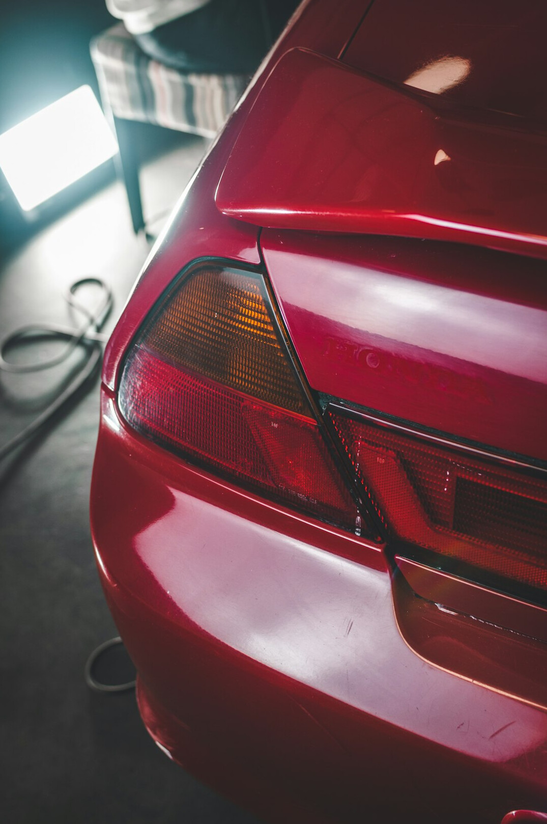 Car bumper with scratches being repaired in a garage