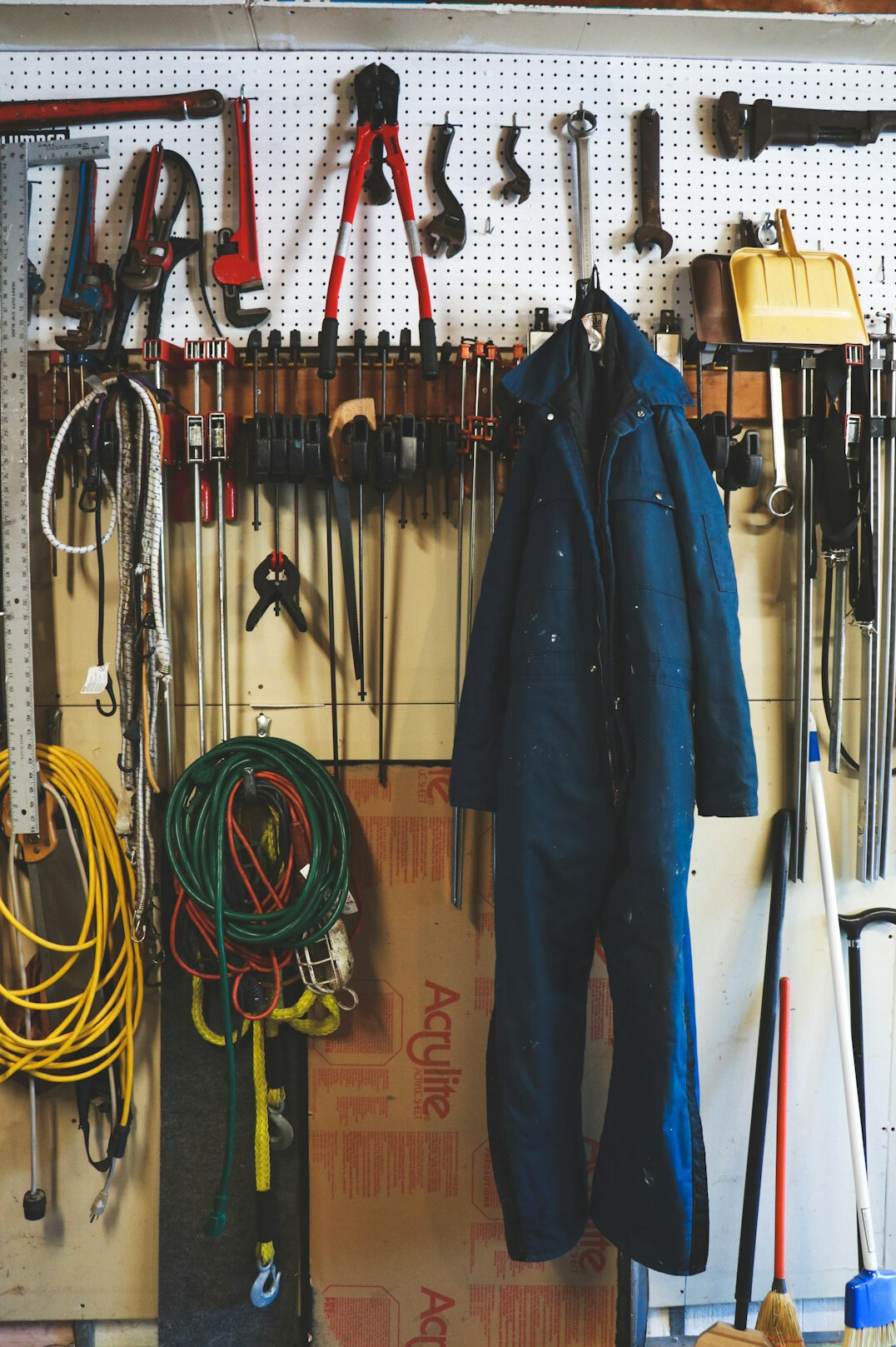 Organised garage workshop with tools on the wall